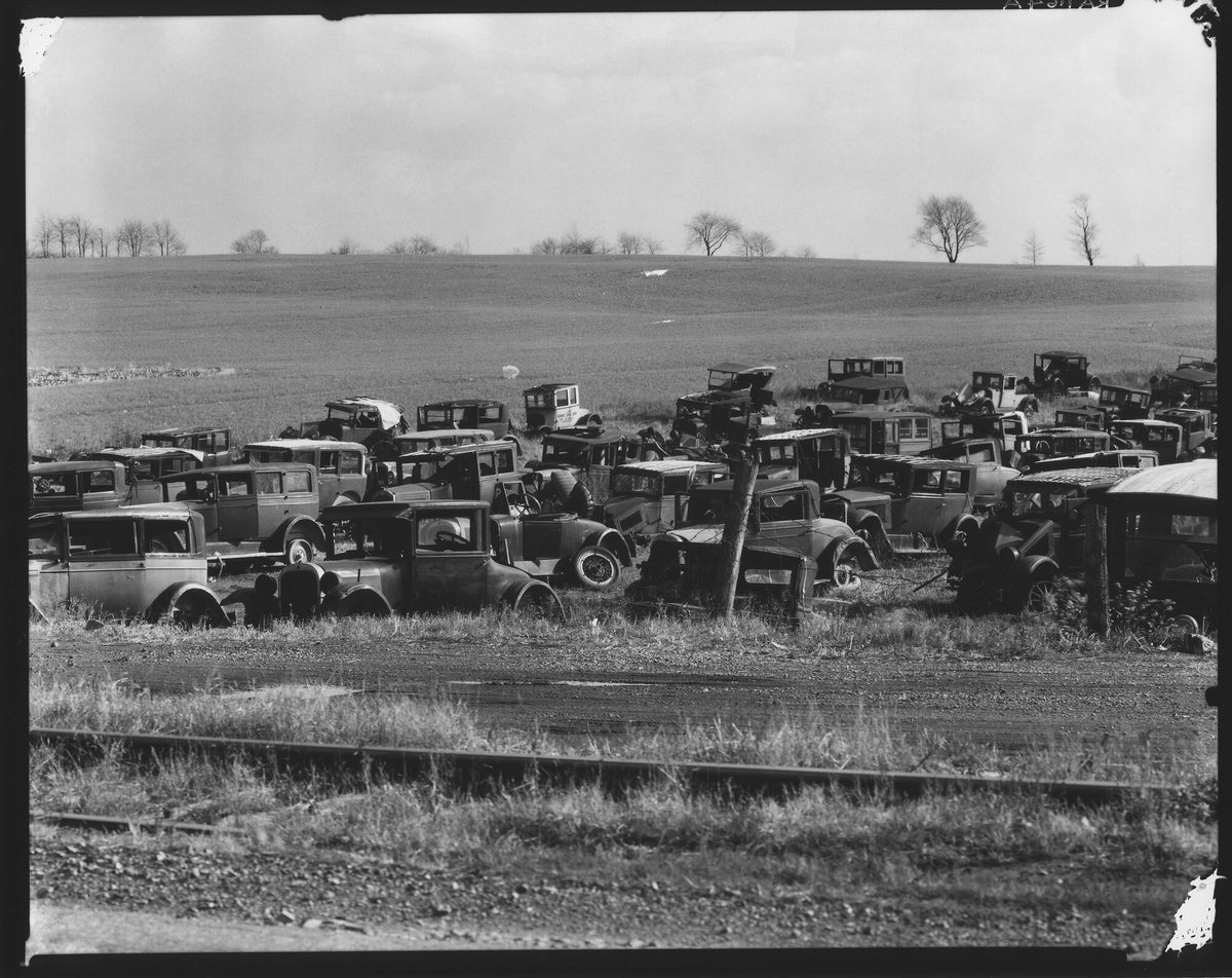 Vintage car junkyard field photograph